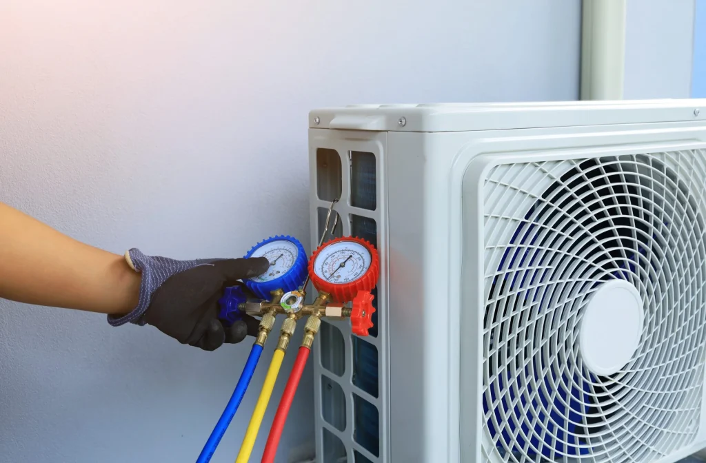 commercial ac unit being tested by a technician