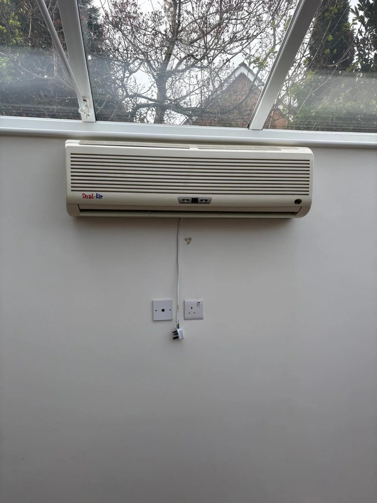 old AC unit in conservatory