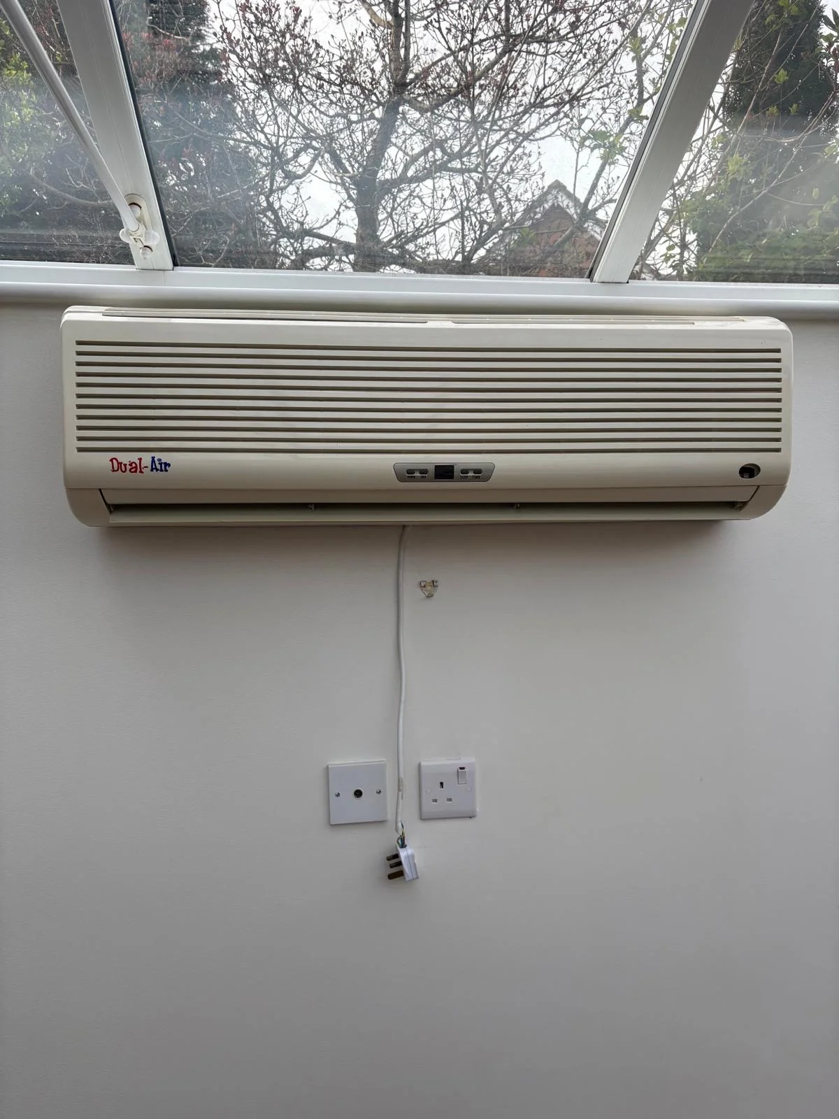 old air conditioning unit in a conservatory